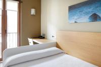 Łóżko lub łóżka w pokoju w obiekcie Hotel Olatu