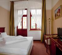 Postel nebo postele na pokoji v ubytování Wellness Hotel Ida