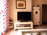 TV a/nebo společenská místnost v ubytování Apartamento primera linea Isla Canela