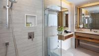 a bathroom with a shower and a toilet and a sink at Amari Phuket in Patong Beach