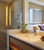 a bathroom with a sink and a shower and a sink at Amari Phuket in Patong Beach