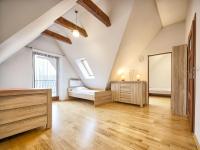 Łóżko lub łóżka w pokoju w obiekcie VisitZakopane - Mount Everest Apartment