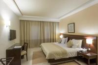 Postel nebo postele na pokoji v ubytování Le Corail Suites Hotel