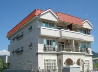 a large building with a red roof at Star 101 Guest House in Taitung City