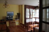 Televízia a/alebo spoločenská miestnosť v ubytovaní Apartamento La Vieja Panadería 1