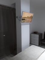 Televízia a/alebo spoločenská miestnosť v ubytovaní Residenza sul Mare