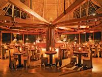 a restaurant with tables and chairs in a room at Inkaterra Reserva Amazonica in Puerto Maldonado
