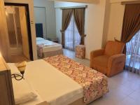 A bed or beds in a room at Hamle Hotel