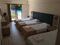 A bed or beds in a room at Hamle Hotel