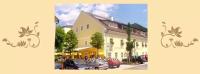 a group of cars parked in front of a building at Gasthof Kemmetmüller in Windischgarsten