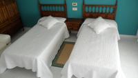 Posteľ alebo postele v izbe v ubytovaní Hostal La Paz