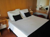 Postel nebo postele na pokoji v ubytování Hotel Eco Salvador