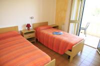 A bed or beds in a room at Addisora Appartamenti