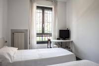 A bed or beds in a room at Bed & Breakfast Cesarina