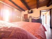 A bed or beds in a room at Il Becco Felice