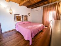 A bed or beds in a room at Il Becco Felice