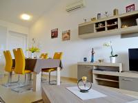 Televízia a/alebo spoločenská miestnosť v ubytovaní Apartment Bellavista