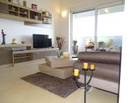 Televízia a/alebo spoločenská miestnosť v ubytovaní Apartment Bellavista