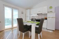 Kuchyň nebo kuchyňský kout v ubytování Apartment Dent