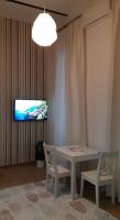 A television and/or entertainment centre at Tempo Life Apartman