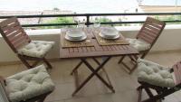 A balcony or terrace at Kallopsia - Glifada Beach Menigos Resort by New Era