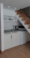 A kitchen or kitchenette at Tempo Life Apartman