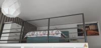 A bed or beds in a room at Tempo Life Apartman