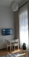 A television and/or entertainment centre at Tempo Life Apartman