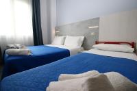 Posteľ alebo postele v izbe v ubytovaní Hotel Kim