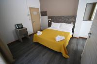 Posteľ alebo postele v izbe v ubytovaní Hotel Kim