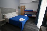 Posteľ alebo postele v izbe v ubytovaní Hotel Kim