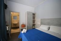 Posteľ alebo postele v izbe v ubytovaní Hotel Kim