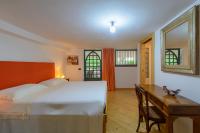 Posteľ alebo postele v izbe v ubytovaní B&B Li Fringi
