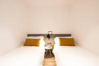 Posteľ alebo postele v izbe v ubytovaní Aspasios Sagrada Familia Apartments