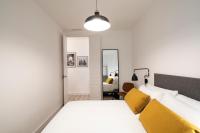Posteľ alebo postele v izbe v ubytovaní Aspasios Sagrada Familia Apartments