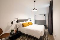 Posteľ alebo postele v izbe v ubytovaní Aspasios Sagrada Familia Apartments