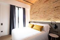 Posteľ alebo postele v izbe v ubytovaní Aspasios Sagrada Familia Apartments