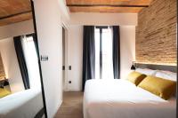 Posteľ alebo postele v izbe v ubytovaní Aspasios Sagrada Familia Apartments