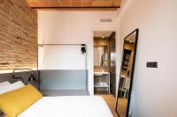 Posteľ alebo postele v izbe v ubytovaní Aspasios Sagrada Familia Apartments