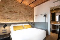 Posteľ alebo postele v izbe v ubytovaní Aspasios Sagrada Familia Apartments