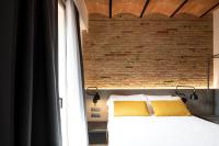 Posteľ alebo postele v izbe v ubytovaní Aspasios Sagrada Familia Apartments