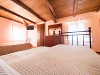 A bed or beds in a room at Il Becco Felice