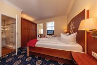 Postel nebo postele na pokoji v ubytování Hotel Deutsche Flagge