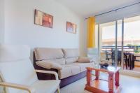 a living room with a couch and a table at Apartamentos Sanlúcar &amp; Doñana in Sanlúcar de Barrameda