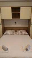 Posteľ alebo postele v izbe v ubytovaní Apartmani Dina