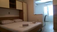Posteľ alebo postele v izbe v ubytovaní Apartmani Dina
