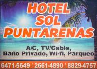 a sign for a hotel in a resort with a beach at Hotel Sol Puntarenas in Puntarenas