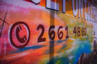 a painting of a sign on the side of a building at Hotel Sol Puntarenas in Puntarenas