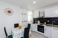 Kuchyň nebo kuchyňský kout v ubytování Apartments A&M