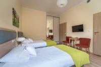 Posteľ alebo postele v izbe v ubytovaní Antonińska Hotel & Apartamenty